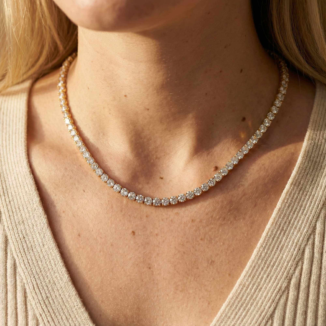 Isolde Tennis Necklace featuring brilliant-cut diamond simulants in 18K gold by Brother & Sisters, capturing light elegantly.