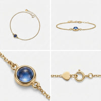 Thumbnail for Photo Projection Bracelet featuring a blue gem, delicate gold chain and adjustable clasp by Brother & Sisters.