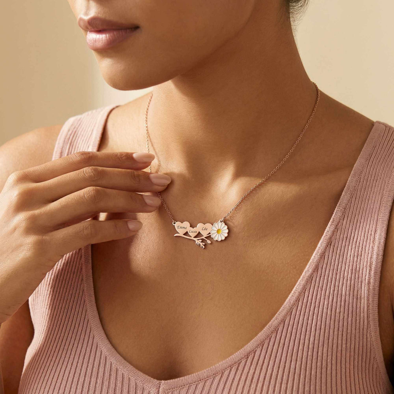 Daisy Name Necklace by Brother & Sisters, featuring connected hearts and delicate white enamel daisy.