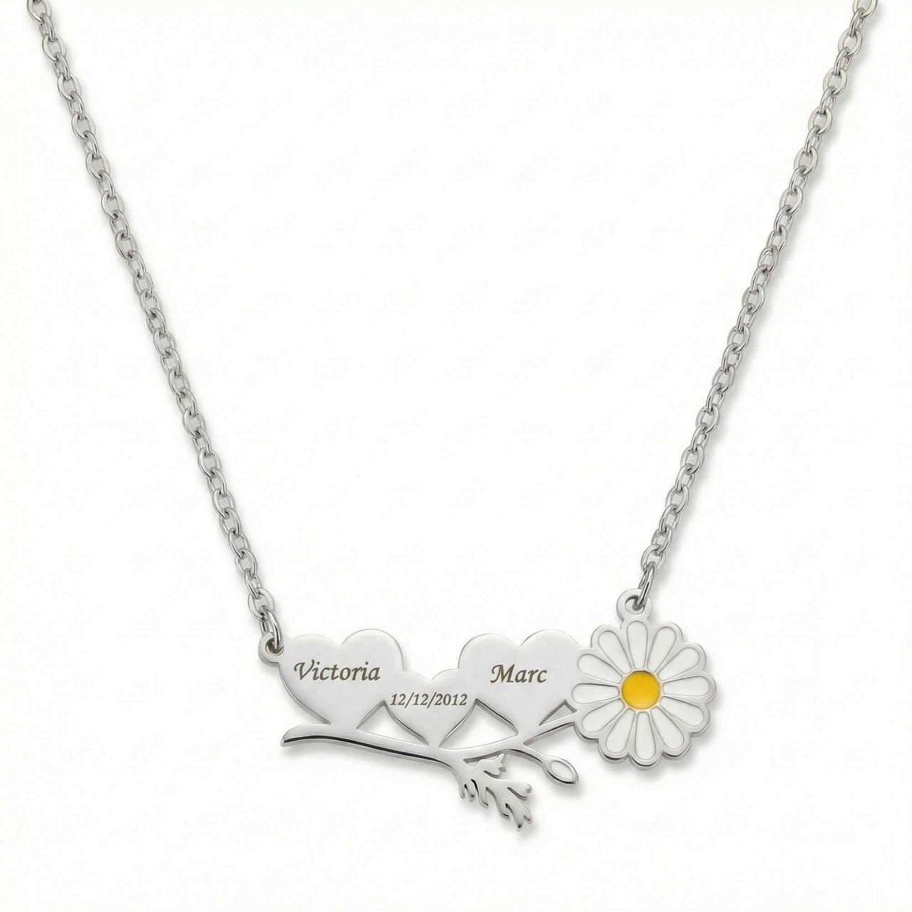 Daisy Name Necklace by Brother & Sisters with engraved hearts and a white enamel daisy, symbolizing love.