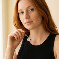 Thumbnail for Precious Name Necklace by Brother & Sisters, engraved with name Léa and birthstone, worn by a model.