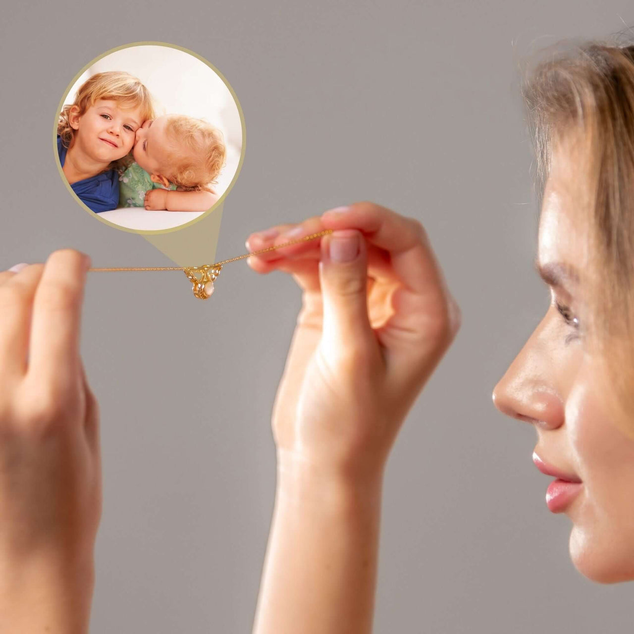 Woman holding the Angel Photo Bracelet featuring a personalized photo of loved ones, designed by Brother & Sisters.