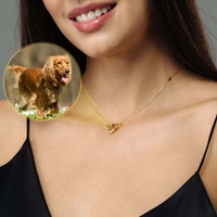 Thumbnail for Woman wearing Angel Photo Necklace by Brother & Sisters, featuring angel wings design with a photo of a golden retriever.