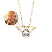 Thumbnail for Angel Photo Necklace by Brother & Sisters featuring angel wings design and a photo locket for cherished memories.