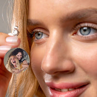 Thumbnail for Angel Photo Necklace by Brother & Sisters featuring a woman holding a pendant displaying a cherished photo.