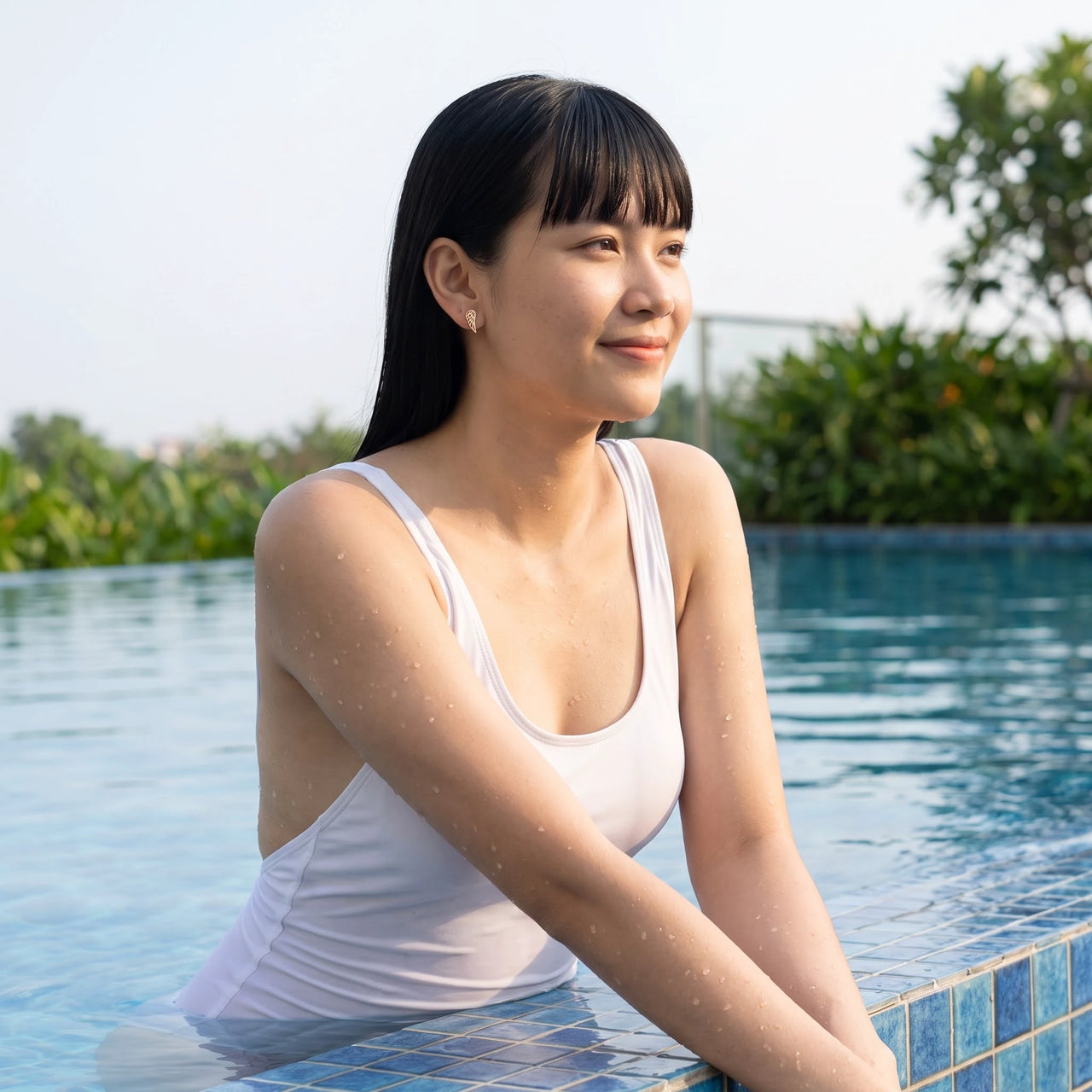 The rose gold stud earrings worn by the pool, waterproof stainless steel | SKU: 42008-rose-gold