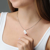 Thumbnail for Baby Bottle Name Necklace featuring a customizable bottle-shaped pendant from Brother & Sisters, showcased on a model.