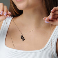 Thumbnail for Woman wearing Baby Bottle Name Necklace with a personalized bottle-shaped pendant.
