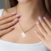 Thumbnail for Baby Bottle Name Necklace worn with a personalized name tag pendant by Brother & Sisters, highlighting unique style.