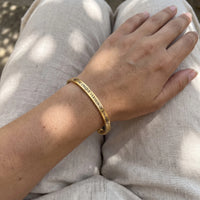 Thumbnail for Be The Unique Version Of Yourself bracelet in gold worn, showing its real size | SKU: btuvoy-g