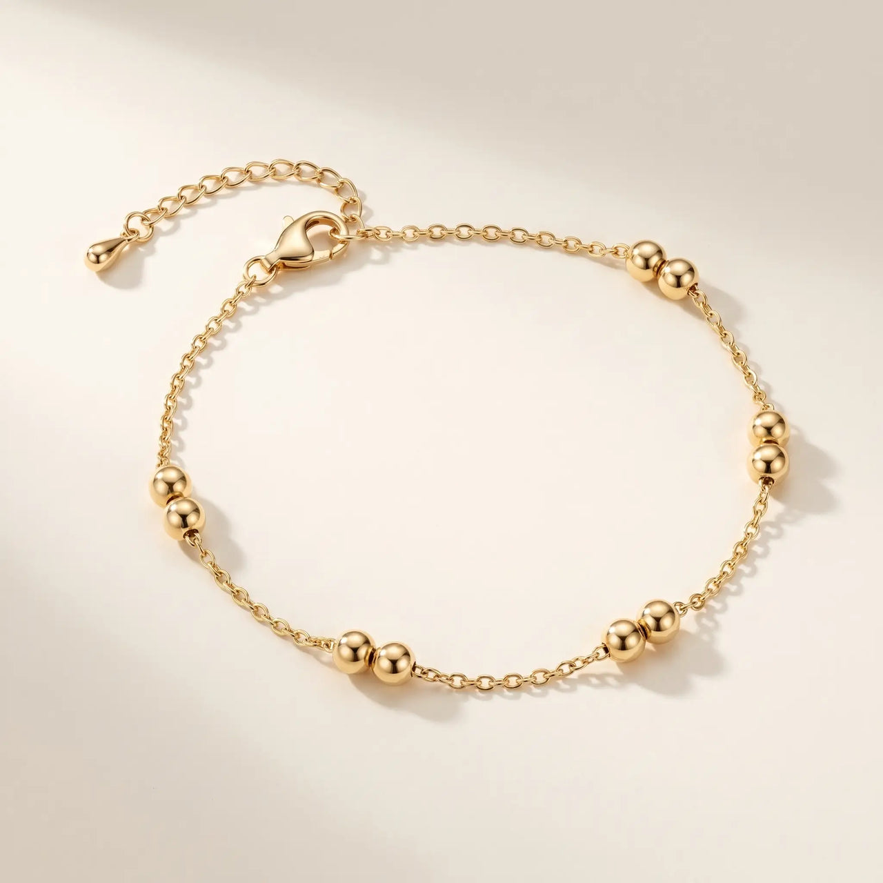Beaded Station Anklet featuring 18K gold-plated stainless steel with paired bead stations from Brother & Sisters.