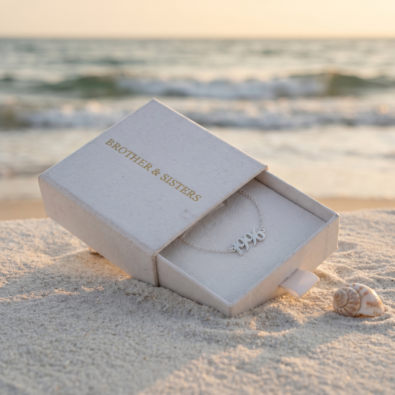Year Number Anklet silver in Brother & Sisters gift box on beach