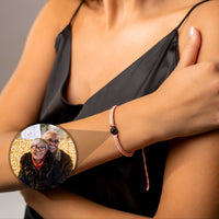 Thumbnail for Pink Photo Bracelet showcasing personalized photo in a circular pendant worn on a woman's wrist.