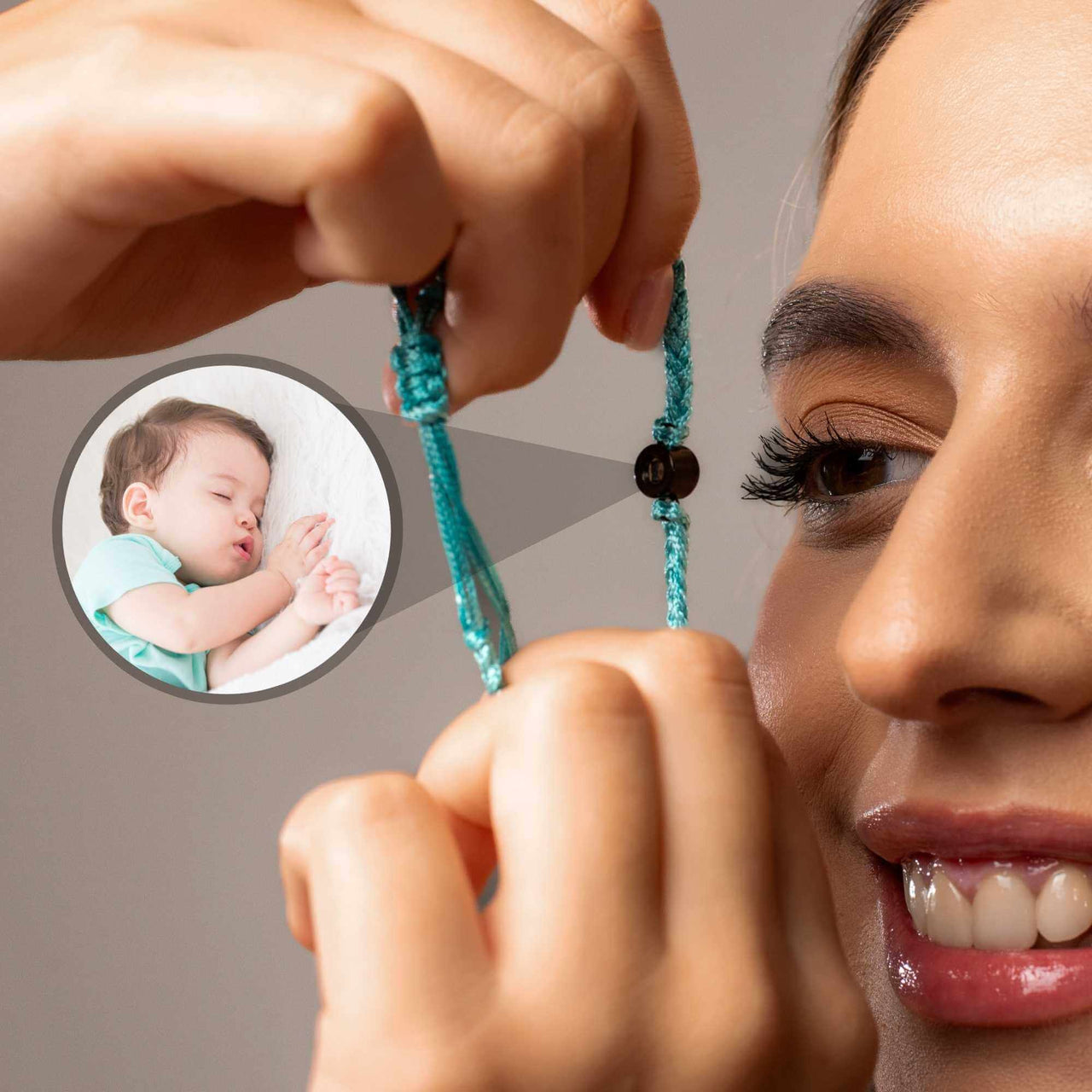 Woman wearing Blue Photo Bracelet featuring a personalized photo of a sleeping baby. Custom jewelry by Brother & Sisters.