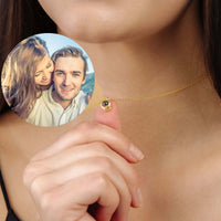 Thumbnail for Personalised Circle Necklace with a custom picture inside, showcasing a couple in a loving moment. Brand: Brother & Sisters.