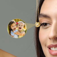 Thumbnail for Circular Photo Necklace featuring a custom photo projection, model showcasing the necklace with kids' picture.