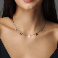 Thumbnail for Classic Name Necklace worn by a woman, featuring personalized letters and crafted in high-quality titanium steel by Brother & Sisters.