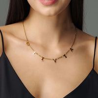 Thumbnail for Classic Name Necklace featuring personalized gold letters on a sleek chain, designed by Brother & Sisters.