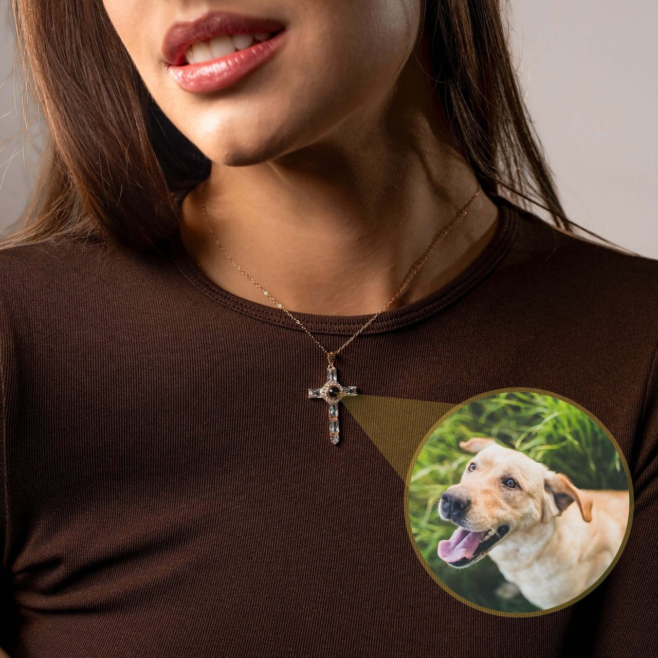 Cross Photo Necklace worn by a woman showcasing a personalized photo projection of a dog, by Brother & Sisters.