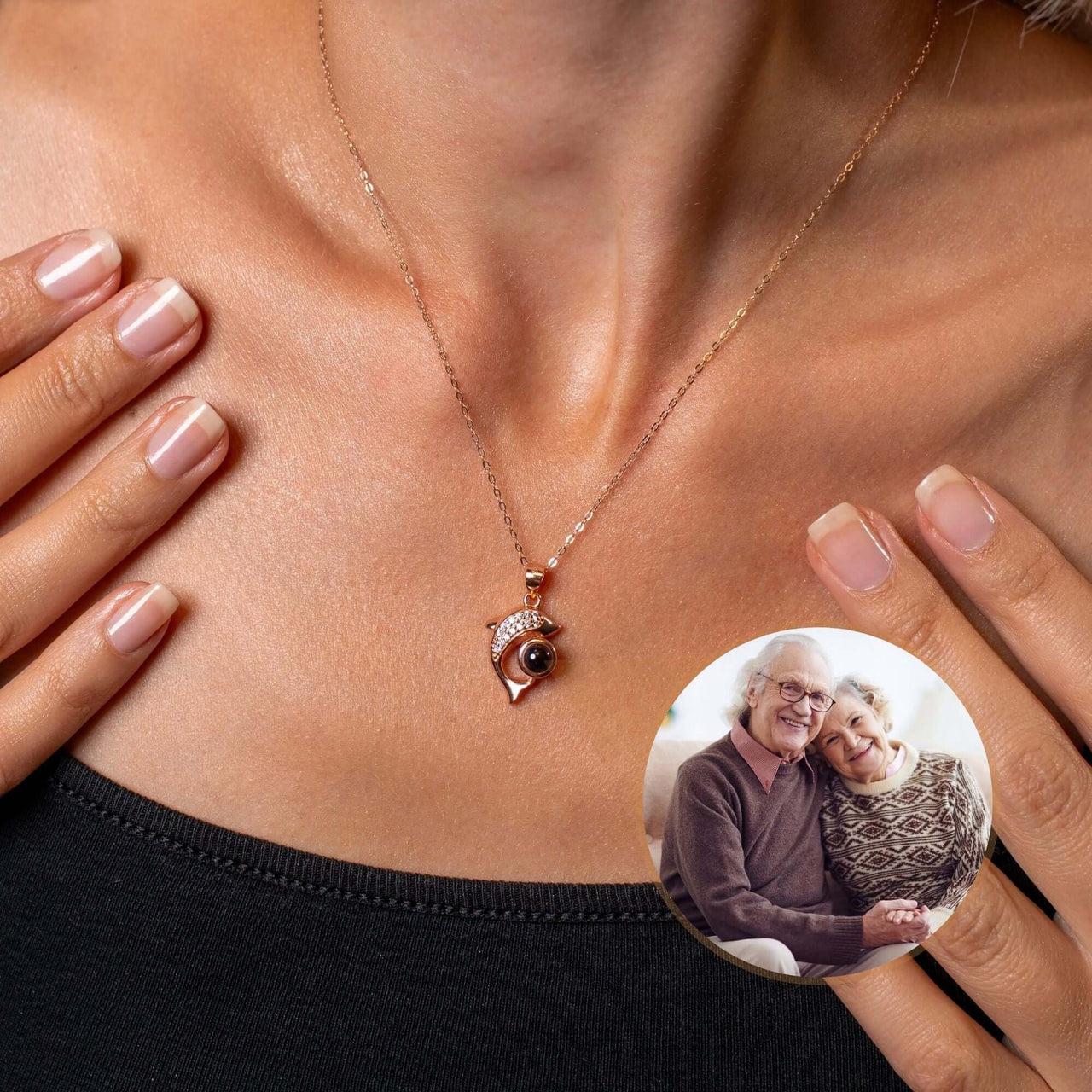 Dolphin Photo Necklace worn by a woman, featuring a custom photo of a couple, by Brother & Sisters.