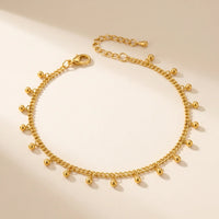 Thumbnail for Drop Bead Anklet by Brother & Sisters, featuring shimmering gold beads on a dainty chain, perfect for summer outfits.