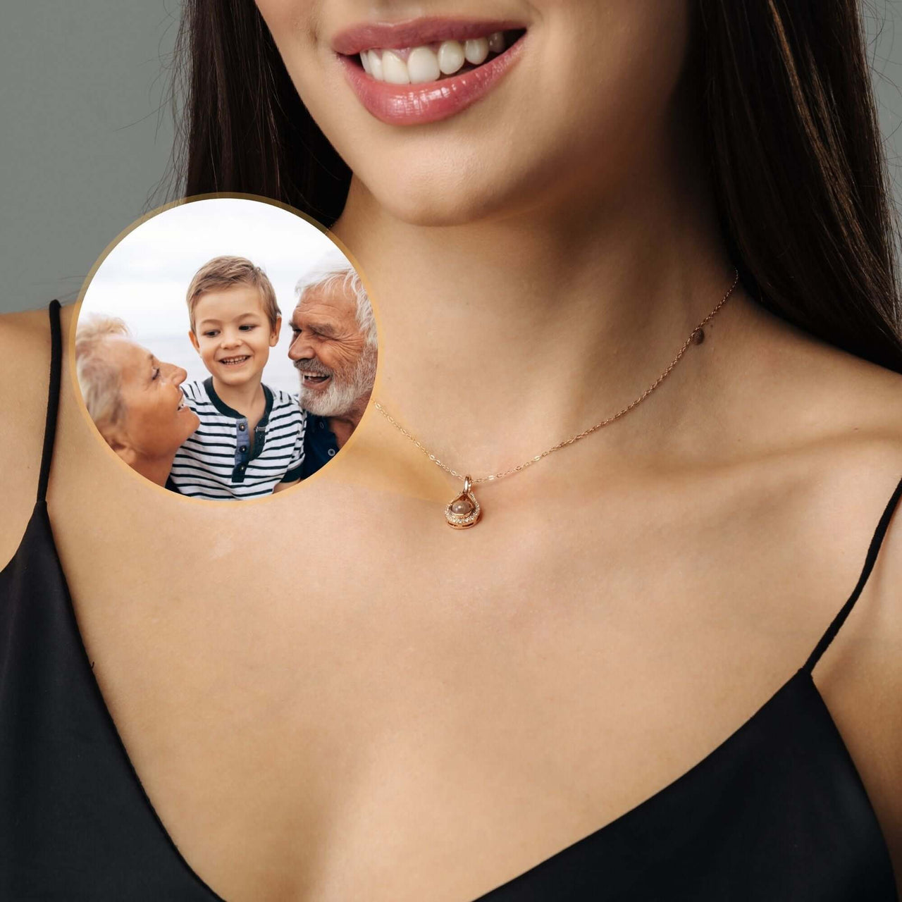Drop Photo Necklace worn by a woman, featuring a personalized pendant with a family photo. Crafted by Brother & Sisters.