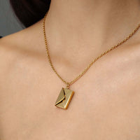 Thumbnail for Envelope Name Necklace featuring a gold envelope pendant on a chain by Brother & Sisters.