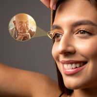 Thumbnail for Eternal Photo Necklace held by a woman, showcasing a cherished photo within its heart charm by Brother & Sisters.