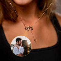 Thumbnail for Close-up of Eye Photo Necklace featuring customizable photo projection by Brother & Sisters, showcasing a couple's image.