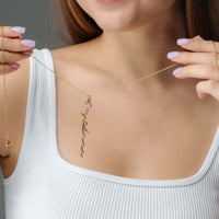 Thumbnail for Woman wearing a Flower Name Necklace by Brother & Sisters, featuring a personalized name and floral design.