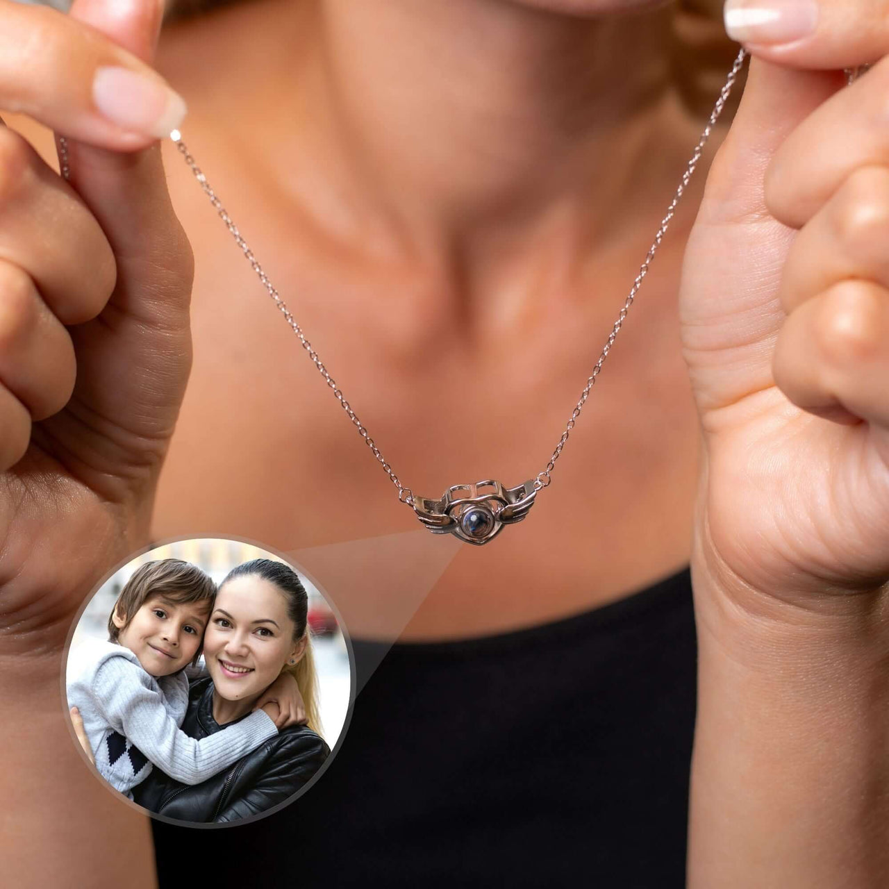 Flying Heart Photo Necklace held by a woman, featuring a personal photo, from Brother & Sisters.