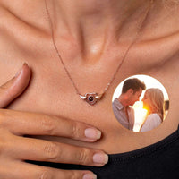 Thumbnail for Flying Heart Photo Necklace with a heart-shaped pendant and wings, perfect for a personal keepsake by Brother & Sisters.