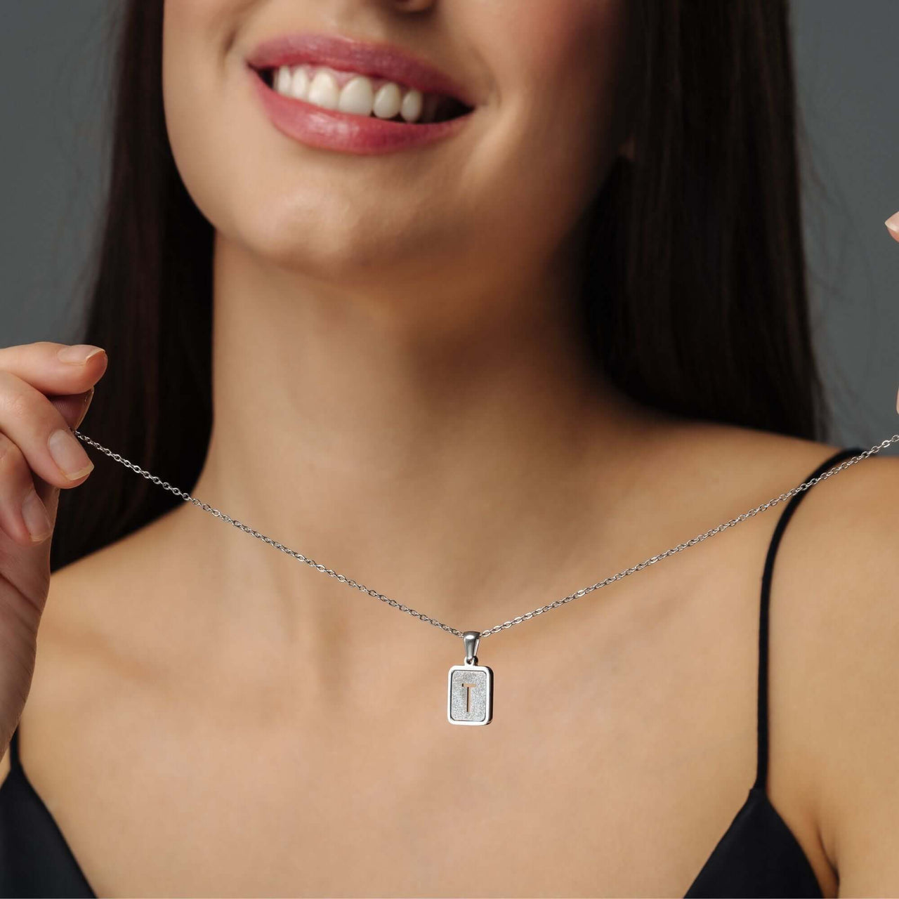 Model wearing Glitter Initial Necklace by Brother & Sisters, showcasing a sparkling personalized letter pendant.