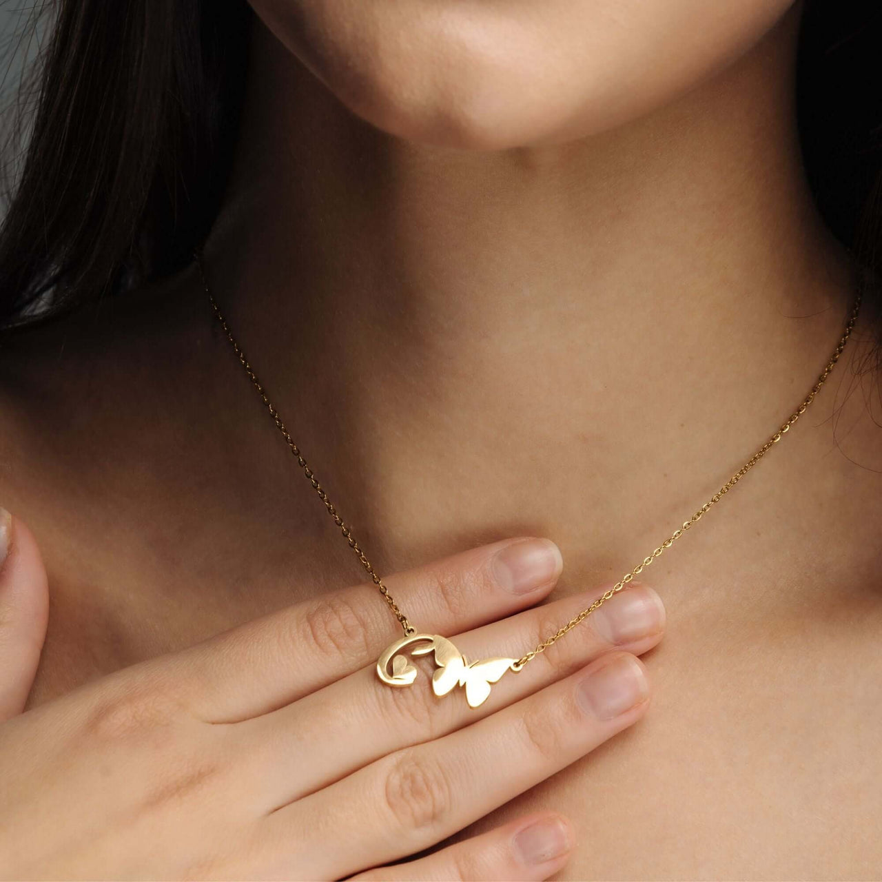 Butterfly Initial Necklace showcasing a delicate butterfly charm and custom initial pendant by Brother & Sisters.