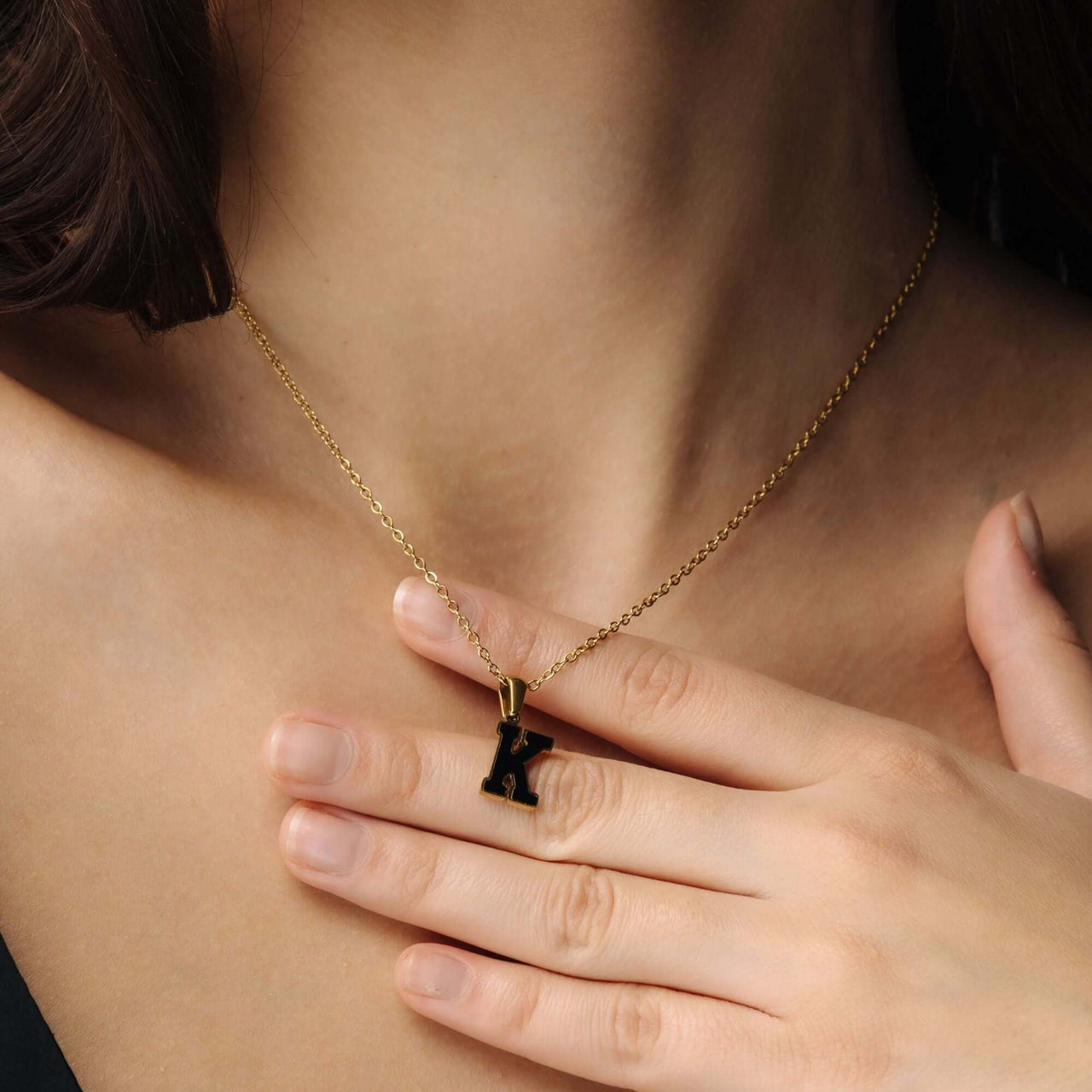 Hope Initial Necklace worn by a woman, featuring a gold chain and elegant initial pendant, by Brother & Sisters.
