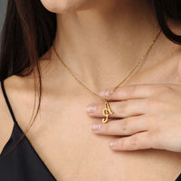Thumbnail for Minimalist Initial Necklace worn by a woman, featuring a gold chain with an elegant initial pendant by Brother & Sisters.