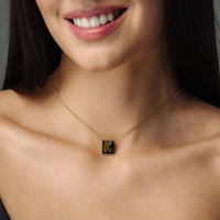 Thumbnail for Rectangle Initial Necklace worn by a woman, featuring a minimalist gold design by Brother & Sisters.