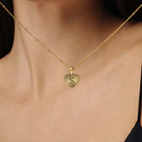Thumbnail for Sentimental Initial Necklace showcased on a woman, featuring a heart-shaped gold pendant with 'S', by Brother & Sisters.