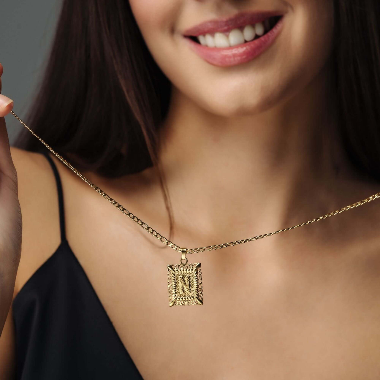 Vintage Initial Necklace worn by a woman showcasing the gold letter charm from Brother & Sisters.