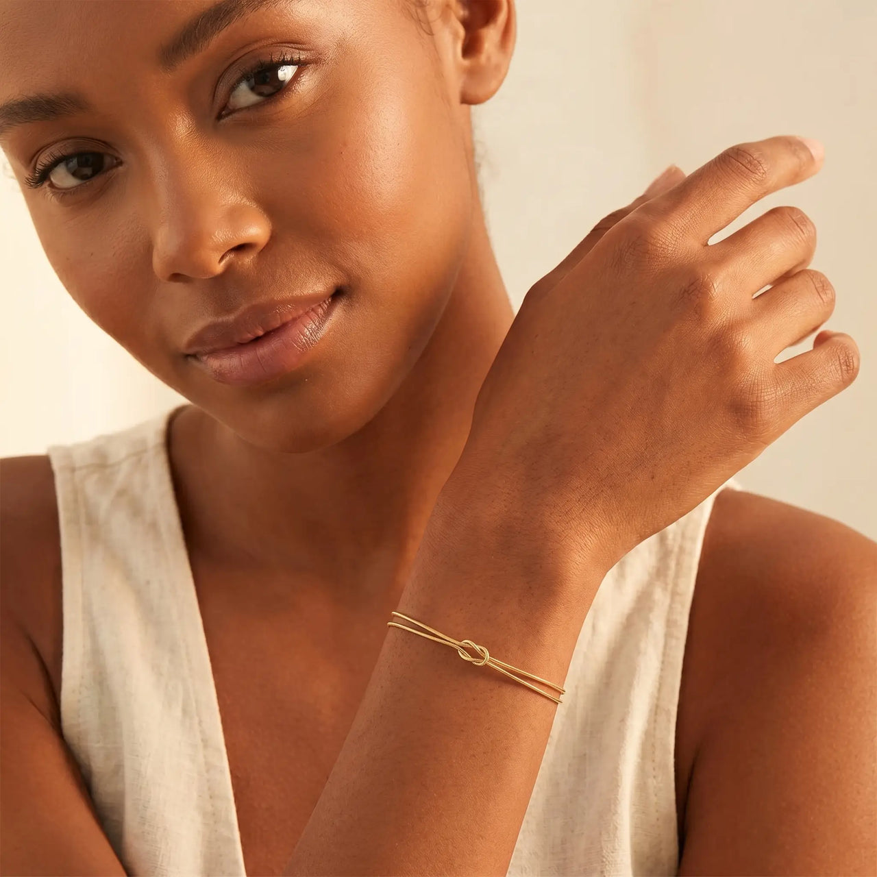 Knot Couple Bracelet gold worn on wrist