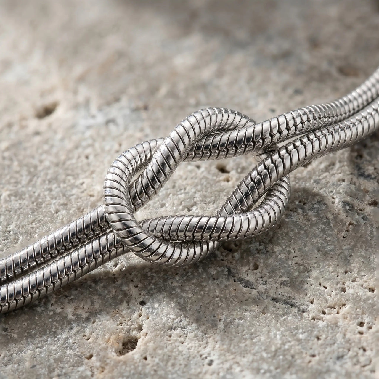 Lane B v2 Knot Couple Bracelet silver macro detail love knot weathered concrete artisan close-up