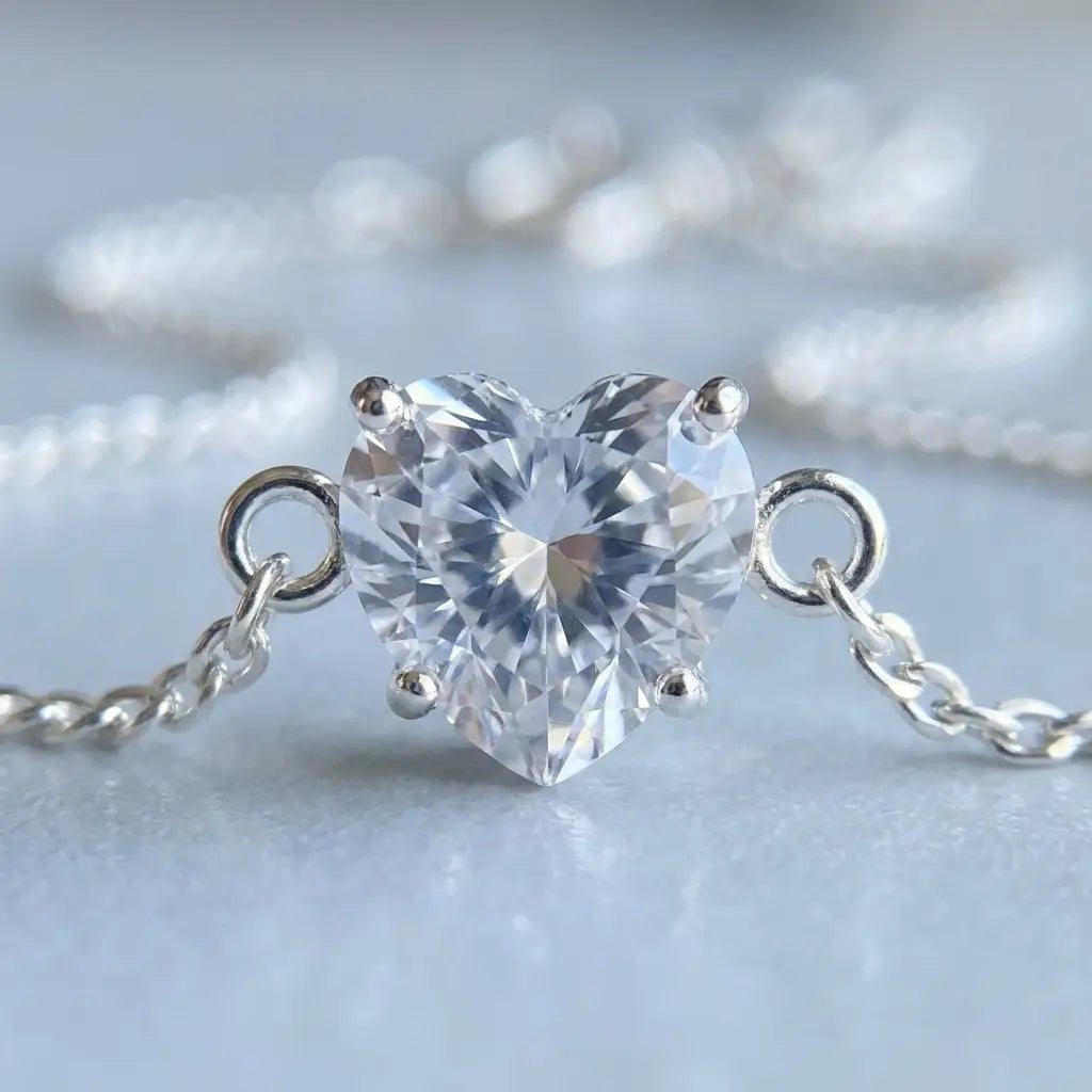 Heart-shaped crystal in 4-prong solitaire setting, silver macro detail
