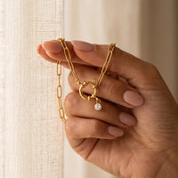 Thumbnail for Carabiner Anklet v5 handheld vertical intimate close-up showing nautical spring-ring clasp and round CZ accent hero