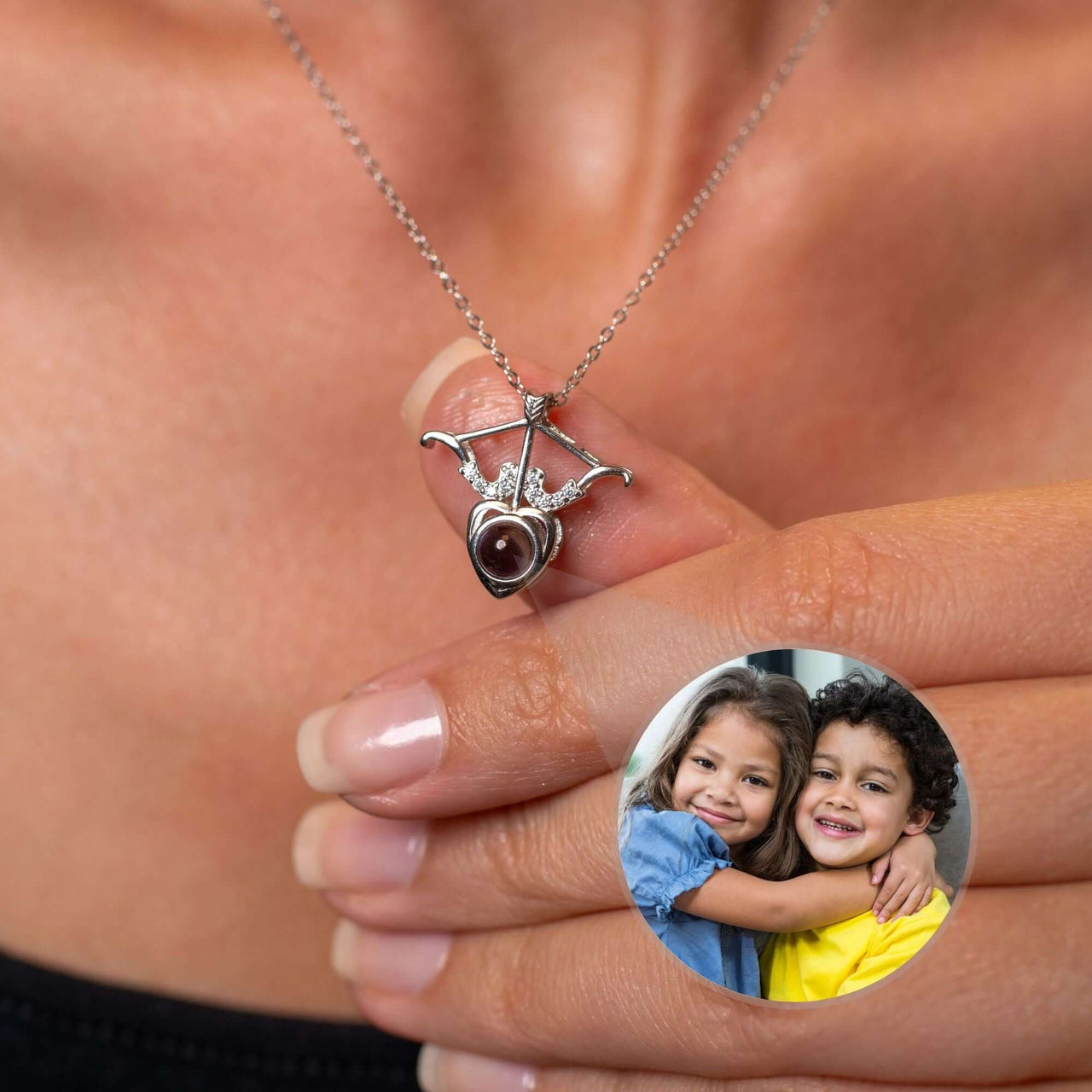 Horn Photo Necklace featuring a personalized heart pendant and a photo of two kids, a keepsake by Brother & Sisters.