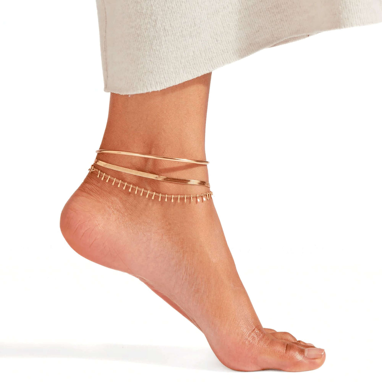 Layla gold snake chain anklet macro detail — high-polish 18K gold plating finish, anti-tarnish guarantee