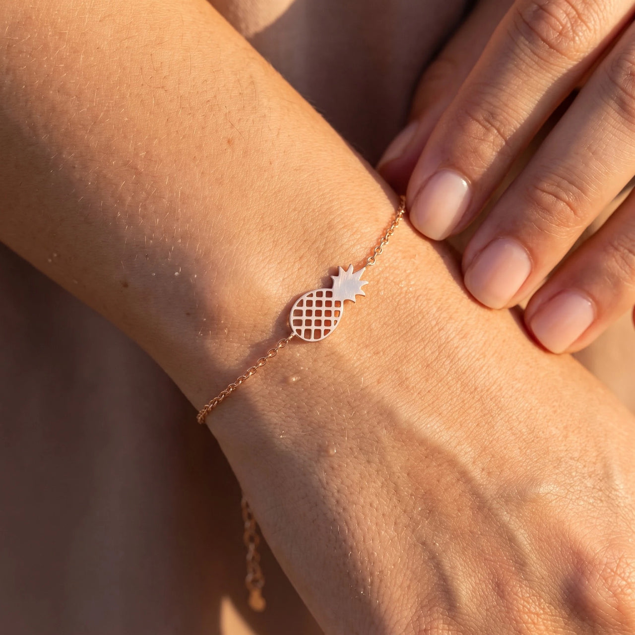 Close-up of the rose gold charm bracelet worn on the skin | SKU: 9178613-rose-gold
