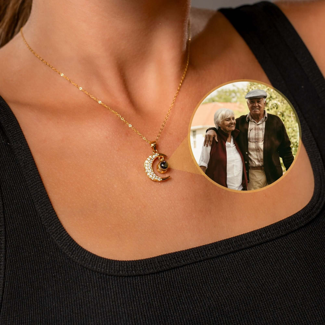 Woman wearing Lucky Moon Photo Necklace by Brother & Sisters, featuring a photo projection of loved ones.