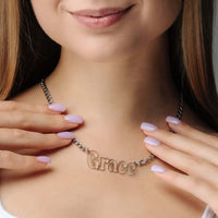 Thumbnail for Luxury Name Necklace worn by a woman, highlighting the personalized design featuring the name Grace by Brother & Sisters.