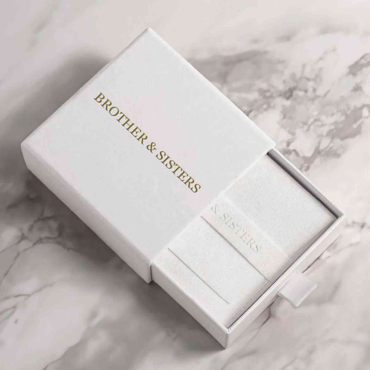 Brother & Sisters gift box for Hearts Photo Necklace, elegant white packaging showcasing brand.