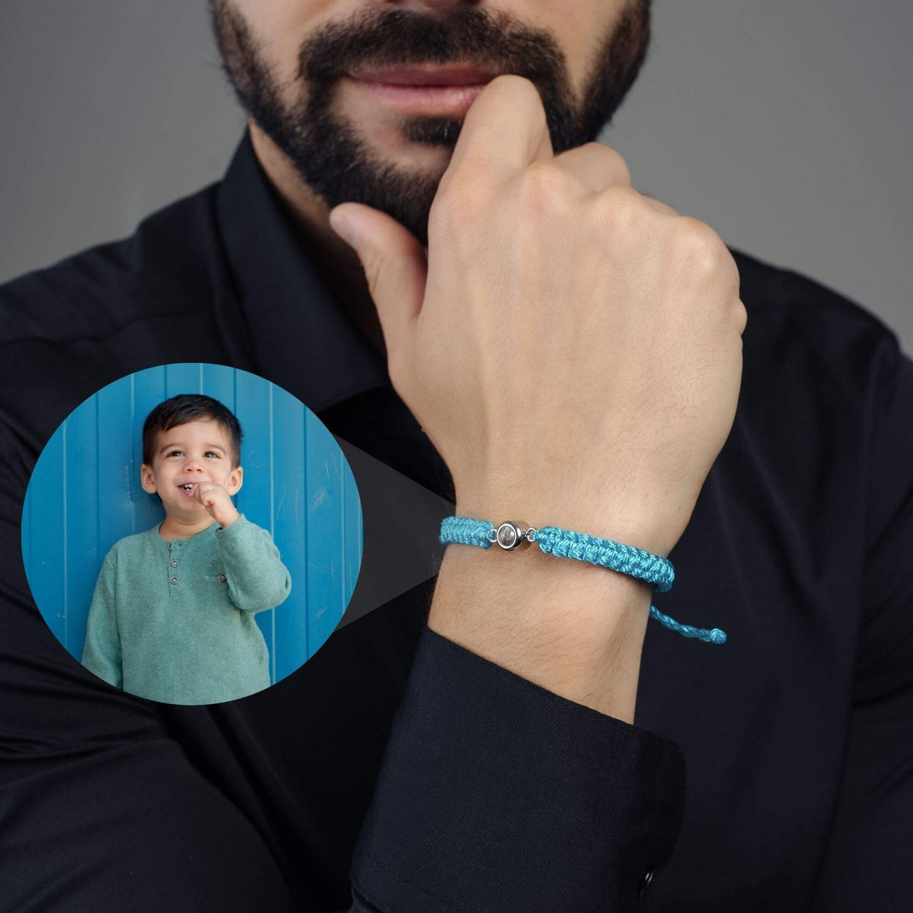 Man Blue Photo Bracelet worn by a man, featuring a photo of a child embedded in the design, by Brother & Sisters.